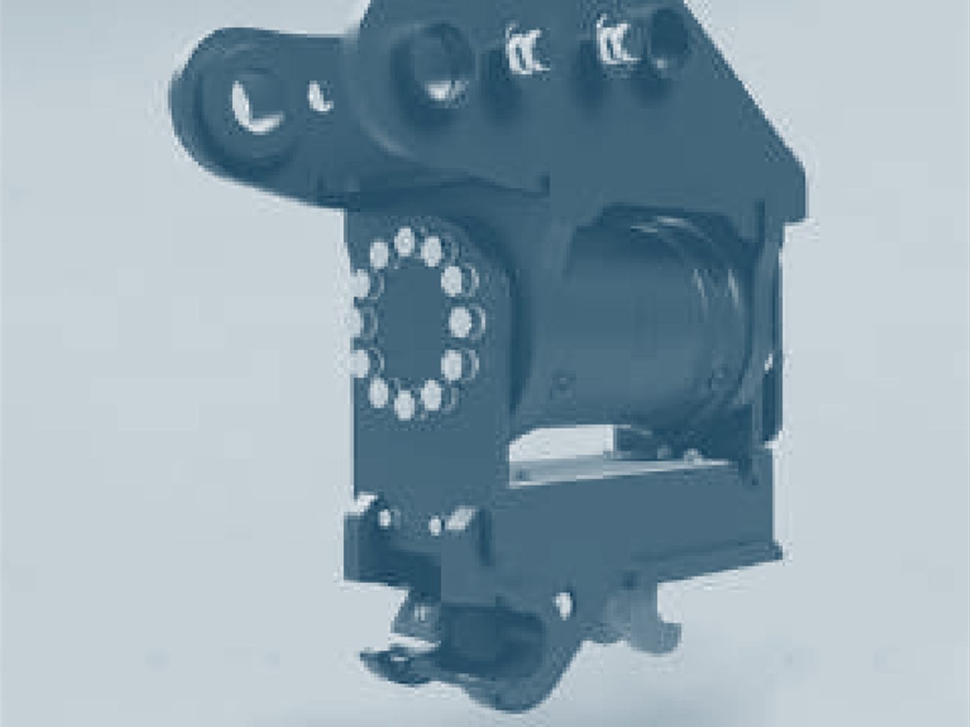 Tilting quick coupler, bolted slew ring visible